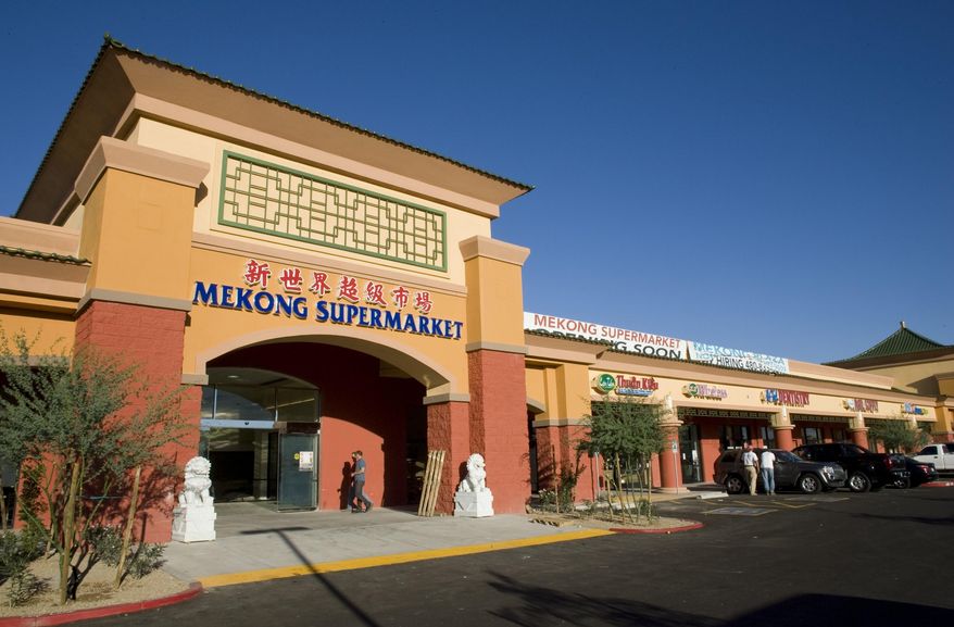 This Oct. 10, 2008, photo shows the exterior of the Mekong Plaza is show in Mesa, Ariz. Dozens of Asian-owned businesses have set up shop in western Mesa, with two large supermarkets serving as anchors for development that includes restaurants and other businesses, is aided by proximity to Mesa Community College and the presence of Arizona State University's main campus in neighboring Tempe. (Mark Henle/The Arizona Republic via AP)