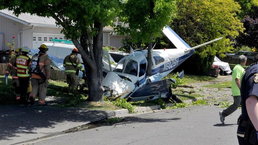 First responders work the scene of a plane crash, Saturday, June 8, 2019 in Medford, Ore. Authorities say the pilot and a passenger were injured after a small plane has crashed in Medford. (Andy Atkinson/The Medford Mail Tribune via AP)