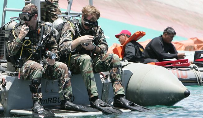 U.S. Navy and Philippine Coast Guard divers conduct search-and-rescue operation for the sunken passenger ferry, MV Princess of the Stars, off Sibuyan Island in central Philippines on Wednesday, June 25, 2008. (AP Photo/Bullit Marquez) ** FILE **