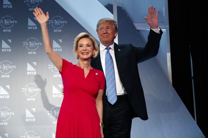 President Donald Trump stands with Juanita Duggan, president and CEO of NFIB, before speaking to the National Federation of Independent Businesses 75th anniversary celebration, Tuesday, June 19, 2018, in Washington. (AP Photo/Evan Vucci) ** FILE **