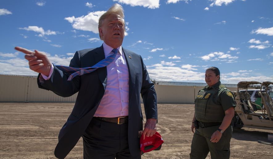 In this Friday, April 5, 2019 file photo, President Donald Trump speaks as he visits a new section of the border wall with Mexico in Calexico, Calif. A federal judge on Friday, May 17, 2019, in California will consider a challenge to Trump's plan to tap billions of dollars from the Defense and Treasury departments to build his prized border wall with Mexico. Twenty states brought one lawsuit; the Sierra Club and Southern Border Communities Coalition, represented by the American Civil Liberties Union, brought the other. (AP Photo/Jacquelyn Martin, File)