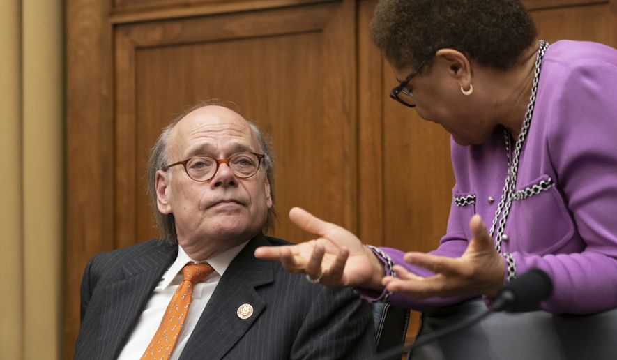 House Judiciary Committee members Rep. Steve Cohen, D-Tenn., left, listens to Rep. Karen Bass, D-Calif., as House Democrats start a hearing to examine whether President Donald Trump obstructed justice, the first of several hearings scheduled by Democrats on special counsel Robert Mueller&#39;s report, on Capitol Hill in Washington, Monday, June 10, 2019.  (AP Photo/J. Scott Applewhite)