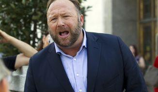 In this Sept. 5, 2018, file photo Infowars host Alex Jones speaks outside of the Dirksen building of Capitol Hill in Washington. (AP Photo/Jose Luis Magana, File)