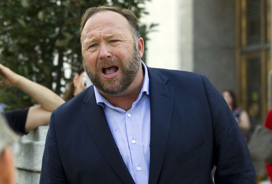 In this Sept. 5, 2018, file photo Infowars host Alex Jones speaks outside of the Dirksen building of Capitol Hill in Washington. (AP Photo/Jose Luis Magana, File)