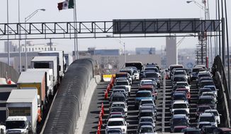 FILE - In this March 29, 2019, file photo, vehicles line up to enter the U.S. from Mexico at a border crossing in El Paso, Texas. Customs and Border Protection said Monday, June 10, that photos of travelers and license plates collected at a single U.S. border point have been exposed in a malicious cyberattack in what a leading congressman called a &amp;quot;major privacy breach.&amp;quot; (AP Photo/Gerald Herbert, File)
