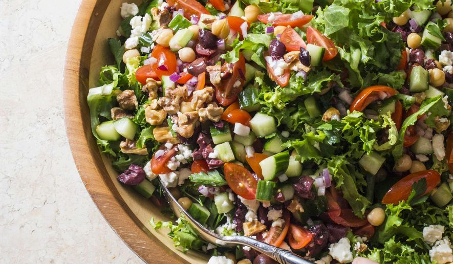 This undated photo provided by America's Test Kitchen in June 2019 shows Mediterranean Chopped Salad. This recipe appears in the cookbook "Nutritious Delicious." (Carl Tremblay/America's Test Kitchen via AP)