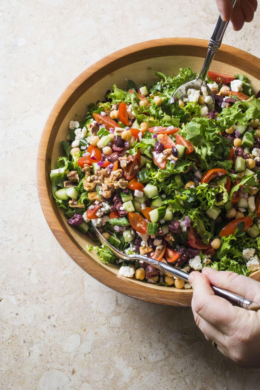 This undated photo provided by America's Test Kitchen in June 2019 shows Mediterranean Chopped Salad. This recipe appears in the cookbook "Nutritious Delicious." (Carl Tremblay/America's Test Kitchen via AP)