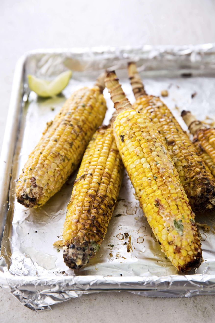 This undated photo provided by America's Test Kitchen in June 2019 shows Mexican Street Corn. This recipe appears in the cookbook "The New Essentials Cookbook." (Joe Keller/America's Test Kitchen via AP)