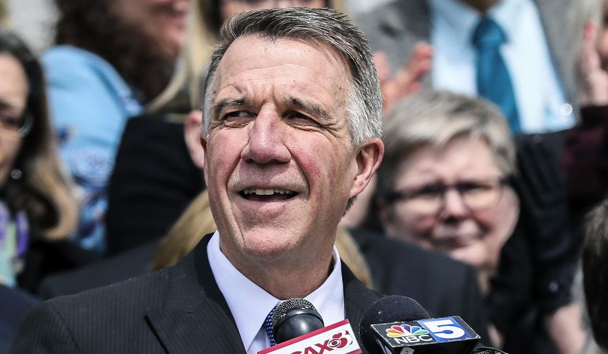 In this April 11, 2018, file photo, Vermont Gov. Phil Scott speaks before signing a gun restrictions bill on the steps of the Statehouse in Montpelier, Vt. On Monday, June 10, 2019, Scott vetoed a bill that would have established a 24-hour waiting period to buy handguns. (AP Photo/Cheryl Senter, File)