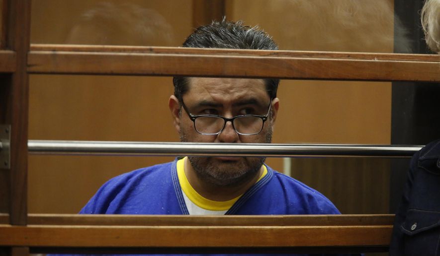 Naason Joaquin Garcia, appears in court in Los Angels, Calif. on Monday, June 10, 2019. García, and his co-defendants face a 26-count felony complaint that alleges crimes including child rape, statutory rape, molestation, human trafficking, child pornography and extortion. The charges detail allegations involving three girls and one woman between 2015 and 2018 in Los Angeles County. (Ringo Chiu/Pool Photo via AP)