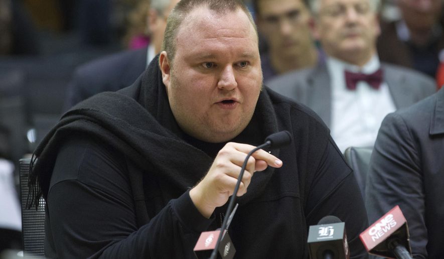 FILE - In this July 3, 2013, file photo, Internet entrepreneur Kim Dotcom speaks during the Intelligence and Security select committee hearing at Parliament in Wellington, New Zealand. Dotcom and three of his former colleagues on Monday, June 10, 2019 took their fight against being extradited to the U.S. to New Zealand’s top court. (Mark Mitchell/New Zealand Herald via AP, File)