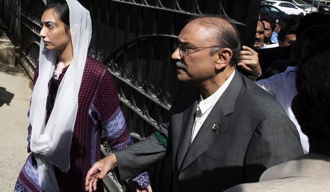 Former Pakistani president and leader of Pakistan People&#x27;s party, Asif Ali Zardari, center, leaves the High Court building with his daughter Asifa Bhutto Zardari, in Islamabad, Pakistan, Monday, June 10, 2019. A Pakistani court has rejected a request by Zardari and his sister for an extension of their bail that would allow them to remain free despite facing a multimillion-dollar money laundering case. (AP Photo/B.K. Bangash)