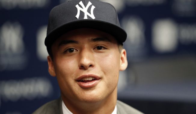 New York Yankees first-round draft pick Anthony Volpe speaks to reporters before a baseball game against the New York Mets, Monday, June 10, 2019, in New York. (AP Photo/Kathy Willens)