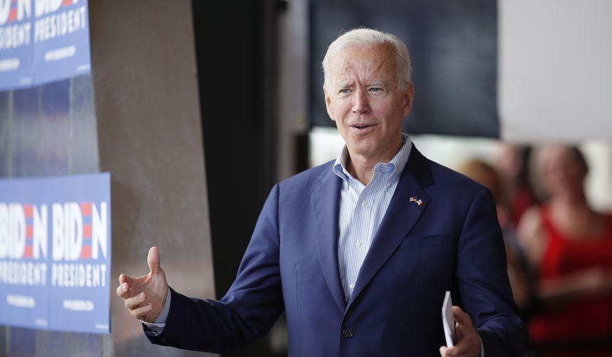Democratic presidential candidate former Vice President Joe Biden greets the crowd at a town hall meeting, Tuesday, June 11, 2019, in Ottumwa, Iowa. (AP Photo/Matthew Putney) ** FILE **