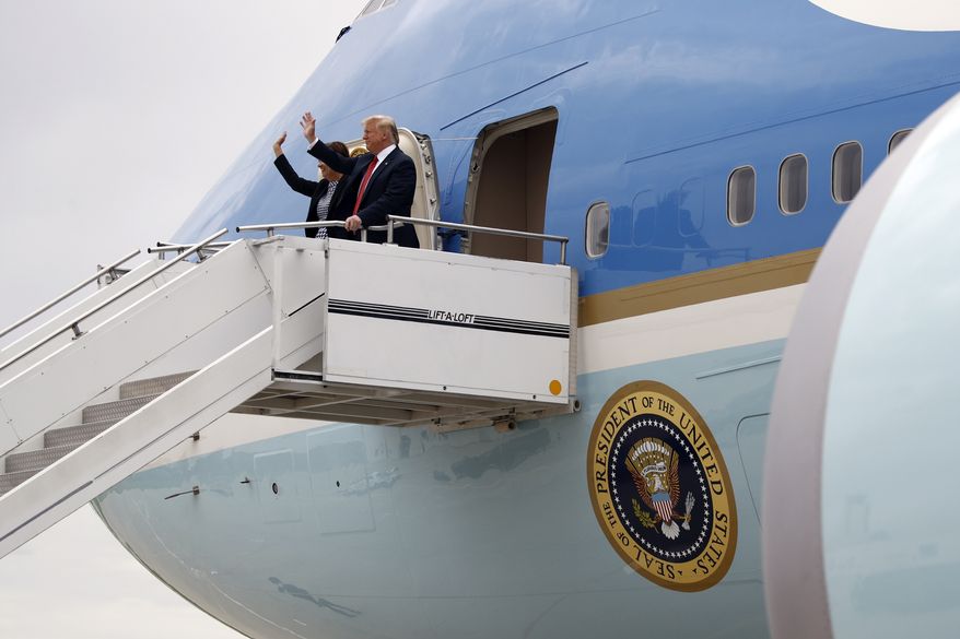 President Donald Trump walks from Air Force One with Iowa Gov. Kim Reynolds at Des Moines International Airport in Des Moines, Iowa, Tuesday, June 11, 2019, to attend a fundraiser in West Des Moines. (AP Photo/Patrick Semansky) **FILE**