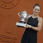 Australia&#39;s Ashleigh Barty poses with the trophy during a photo call at the Roland Garros stadium in Paris, Sunday, June 9, 2019. Barty won the French Open tennis tournament women&#39;s final on Saturday June 8, 2019. (AP Photo/Michel Euler)