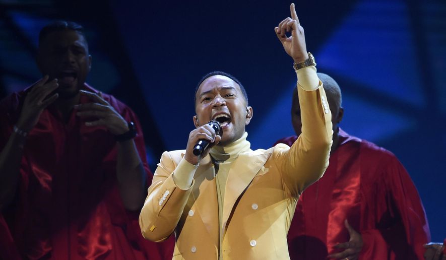 In this March 14, 2019, file photo, John Legend performs &quot;Preach&quot; at the iHeartRadio Music Awards at the Microsoft Theater in Los Angeles. Legend says Hollywood should consider boycotting Georgia, Louisiana, Alabama and other states that pass restrictive abortion laws. The Grammy and Oscar-winning singer says he isn’t sure a boycott would lead to the states changing course, but he knows that “money talks.” (Photo by Chris Pizzello/Invision/AP, File) **FILE**