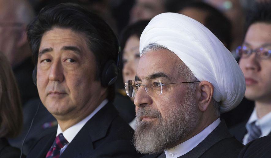 In this Jan. 22, 2014, file photo, Japanese Prime Minister Shinzo Abe, left, and Iranian President Hassan Rouhani, attend a session of the World Economic Forum in Davos, Switzerland. Abe&#39;s trip to Tehran on Wednesday, June 12, 2019, represents the highest-level effort yet to de-escalate tensions between the U.S. and Iran. The visit comes as Iran appears poised to break the 2015 nuclear deal it struck with world powers that America earlier abandoned. (AP Photo/Michel Euler, File)