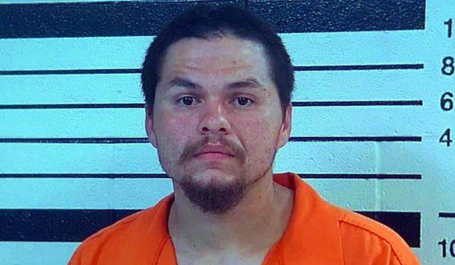 This booking image provided by the Yakama Nation shows James Cloud, who was charged along with Donovan Quinn Carter Cloud, with assault with a deadly weapon, for actions related to pointing a gun at a child. According to court documents filed in U.S. District Court in Yakima, Wash., they were identified by witnesses as having shot and killed several people on Saturday, June 8, 2016, the documents state. However, it was unclear if they would be charged with the killings. (Yakama Nation/Yakima Herald-Republic via AP)