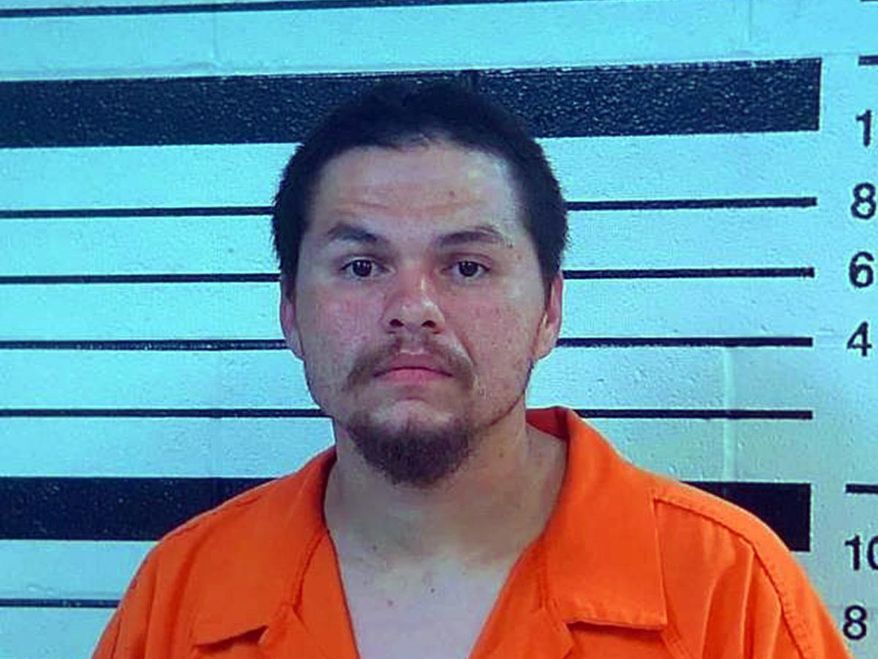 This booking image provided by the Yakama Nation shows James Cloud, who was charged along with Donovan Quinn Carter Cloud, with assault with a deadly weapon, for actions related to pointing a gun at a child. According to court documents filed in U.S. District Court in Yakima, Wash., they were identified by witnesses as having shot and killed several people on Saturday, June 8, 2016, the documents state. However, it was unclear if they would be charged with the killings. (Yakama Nation/Yakima Herald-Republic via AP)