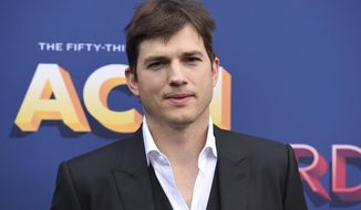 In this April 15, 2018, file photo, Ashton Kutcher arrives at the 53rd annual Academy of Country Music Awards at the MGM Grand Garden Arena in Las Vegas. The News and Sentinel reports Parkersburg High School Principal Kenny DeMoss was suspended Tuesday, June 11, 2019 at a Wood County Board of Education meeting. DeMoss apologized for heavily basing his May address on Kutcher&#39;s 2013 Nickelodeon Teen Choice Awards speech. He has said he should’ve cited his sources, but the ideas were his own. (Photo by Jordan Strauss/Invision/AP, File)