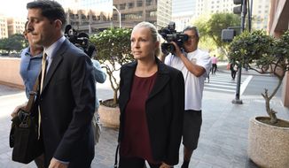 In this Thursday, Aug. 23, 2018, file photo, Margaret Hunter, center, the wife of U.S. Rep. Duncan Hunter, arrives for an arraignment hearing in San Diego. (AP Photo/Denis Poroy) ** FILE **