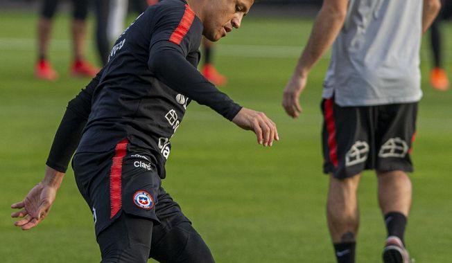 Chile's Alexis Sanchez controls a soccer ball during a training session in Santiago, Chile, Monday, June 3, 2019, ahead of the Copa America in neighboring Brazil. (AP Photo/Esteban Felix)