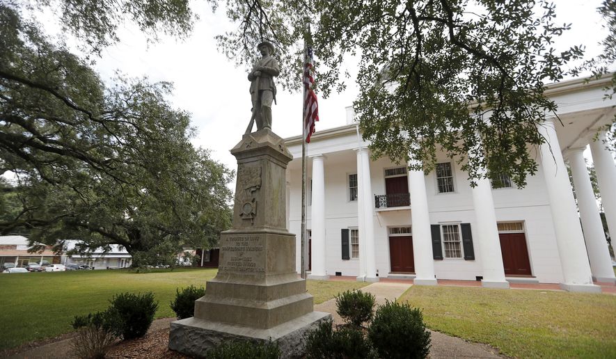 FILE - In this Aug. 1, 2018 file photo, a statue commemorating fallen confederate soldiers stands on front of the East Feliciana Parish Courthouse in Clinton, La. An appeals court on Tuesday, June 11, 2019 rejected a request by Louisiana defendant Ronnie Anderson to have his trial moved from the courthouse with a Confederate monument out front. The one-page ruling gave no reasoning for the decision. (AP Photo/Gerald Herbert, File)