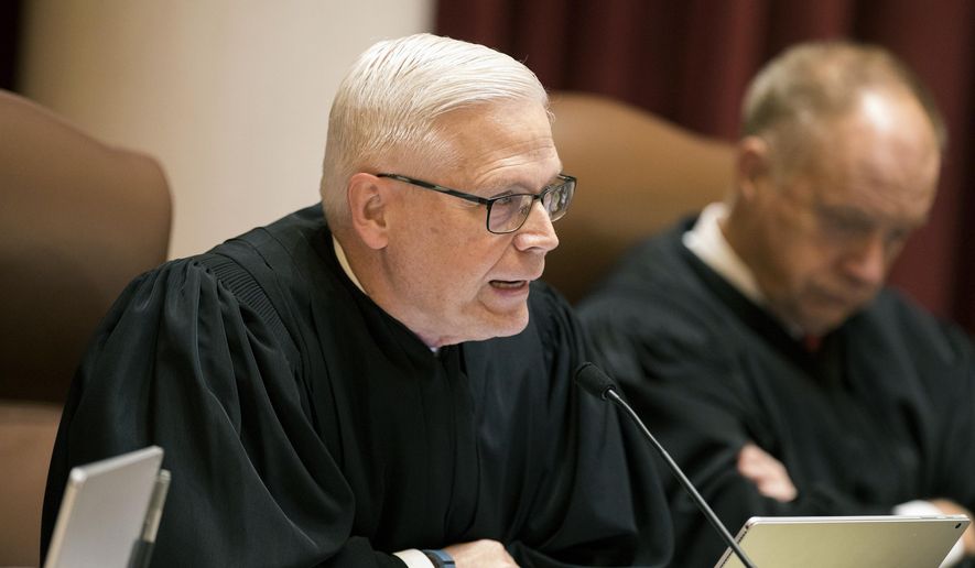 FILE - In this Aug. 28, 2017 file photo, Minnesota Supreme Court Associate Justice David L. Lillehaug asks questions during oral arguments at the Capitol in St. Paul, Minn. Lillehaug says he has Parkinson's disease and won't seek re-election next year. Lillehaug says in a statement via the court that he expects to resign in July 2020. (Leila Navidi/Star Tribune via AP, File)