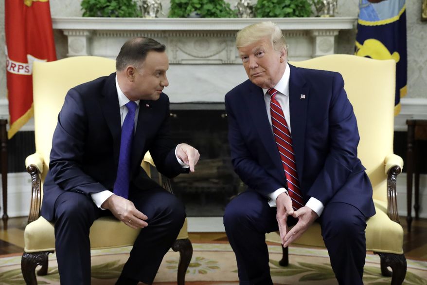 President Donald Trump meets with Polish President Andrzej Duda in the Oval Office of the White House, Wednesday, June 12, 2019, in Washington. (AP Photo/Evan Vucci)