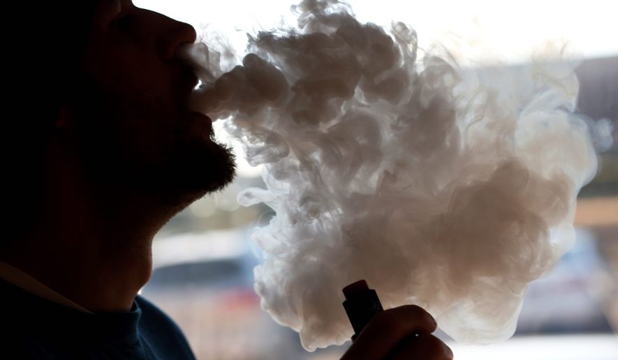 E-cigarettes are not considered as risky as regular cigarettes, but youth advocacy groups are worried about the dramatic rise in use among middle and high school students. (Associated Press/File)