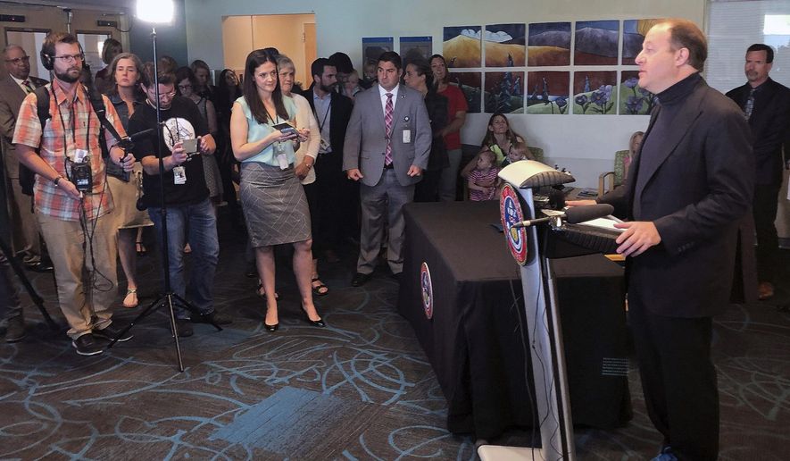 Colorado Gov. Jared Polis speaks to reporters before signing an order to boost the state's child vaccination rates at Children's Hospital Colorado in Denver, Thursday, June 13, 2019. Colorado's governor issued an executive order Thursday designed to address Colorado's poor vaccination rates for children, but he insisted that he will respect existing religious and personal exemptions for parents unwilling to inoculate their children against communicable diseases. (AP Photo/Jim Anderson)