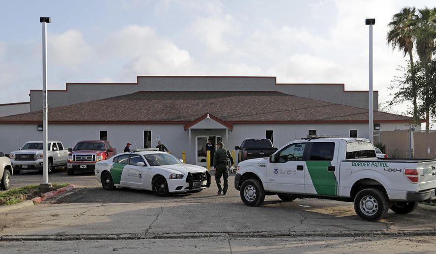 FILE - In this Saturday, June 23, 2018, file photo, a U.S. Border Patrol Agent walks between vehicles outside the Central Processing Center in McAllen, Texas. Advocates were shocked to find an underage mom and her tiny, premature newborn daughter huddled in a Border Patrol facility the second week of June 2019, in what they say was another example of the poor treatment immigrant families receive after crossing the border. The mother is a Guatemalan teen who crossed the border without a parent and was held at a facility in McAllen, Texas, with other families with children. (AP Photo/David J. Phillip, File)