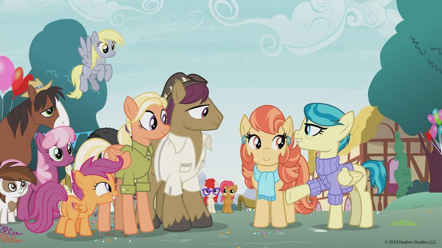This photo provided by Hasbro Studios LLC/Discovery Family shows a scene from the Discovery Family Channel cartoon series “My Little Pony: Friendship is Magic," coinciding with Pride Month. “My Little Pony” has introduced a same-sex couple on the show for the first time. Writer-producer Michael Vogel told People on Thursday, June 13, 2019, that the timing of the episode, “The Last Crusade,” is a happy coincidence. The episode introduces a lesbian couple, Aunt Holiday and Auntie Lofty. They care for Scootaloo. (Hasbro Studios LLC/Discovery Family via AP)