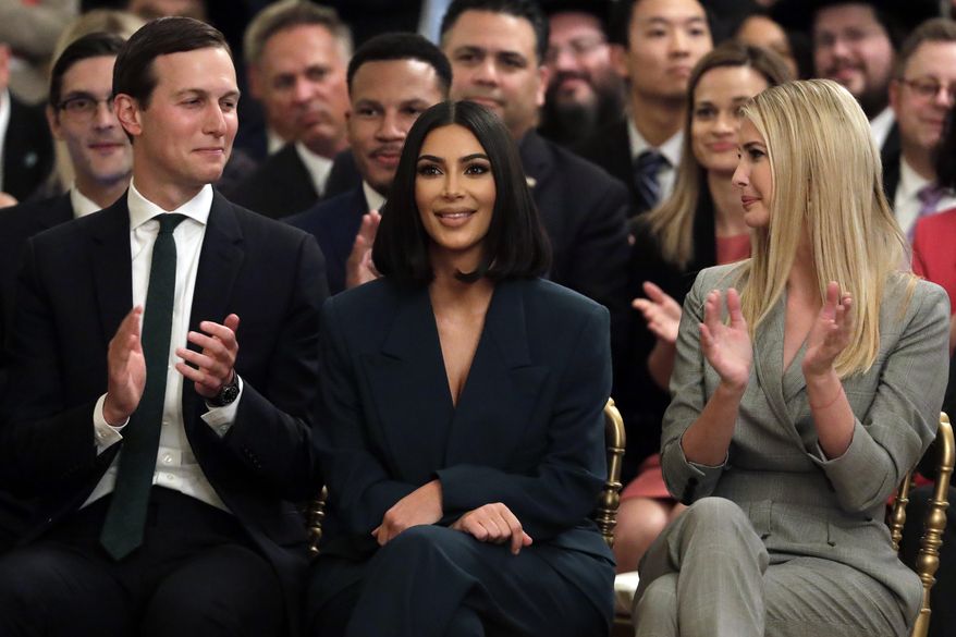White House senior adviser Jared Kushner and Ivanka Trump, right, sit with Kim Kardashian, who is among the celebrities who have advocated for criminal justice reform, as they listen to President Donald Trump speak about second chance hiring in the East Room of the White House, Thursday June 13, 2019, in Washington. (AP Photo/Evan Vucci)
