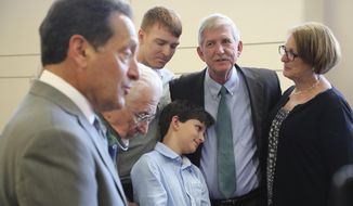 Attorney Lee Plakas talks Thursday, June 13, 2019, in Elyria, Ohio, about the decision in his clients&#39; lawsuit claiming Oberlin College hurt their business and libeled them. In the background are Allyn W. Gibson, Allyn D. Gibson, Cashlyn Gibson, 11, David Gibson, and Lorna Gibson. A jury in Lorain County awarded David Gibson, son Allyn Gibson and Gibson&#39;s Bakery, of Oberlin, $33 million in punitive damages Thursday. That comes on top of an award a day earlier of $11 million in compensatory damages. (Bruce Bishop/Chronicle-Telegram via AP)