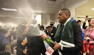  In this June 13, 2019, file photo, Toronto Raptors President Masai Ujiri celebrates after the team&#39;s 114-110 win over the Golden State Warriors in Game 6 of basketball&#39;s NBA Finals in Oakland, Calif. Authorities say they are investigating whether Toronto Raptors president Masai Ujiri pushed and hit a sheriff&#39;s deputy in the face as he tried to get on the court after his team won the NBA title in Oakland. (Frank Gunn/The Canadian Press via AP, File) **FILE**