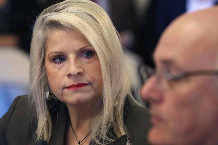 In this Wednesday, Jan. 28, 2015, file photo, Sen. Linda Collins-Smith, R-Pocahontas, listens to testimony at a meeting of the Senate Committee on Public Health, Welfare and Labor at the Arkansas state Capitol in Little Rock, Ark. Authorities on Friday, June 14, 2019, said they've arrested an Arkansas woman in connection with the killing of former state Sen. Linda Collins-Smith, who was found dead outside her own home, on June 4. (AP Photo/Danny Johnston, File)