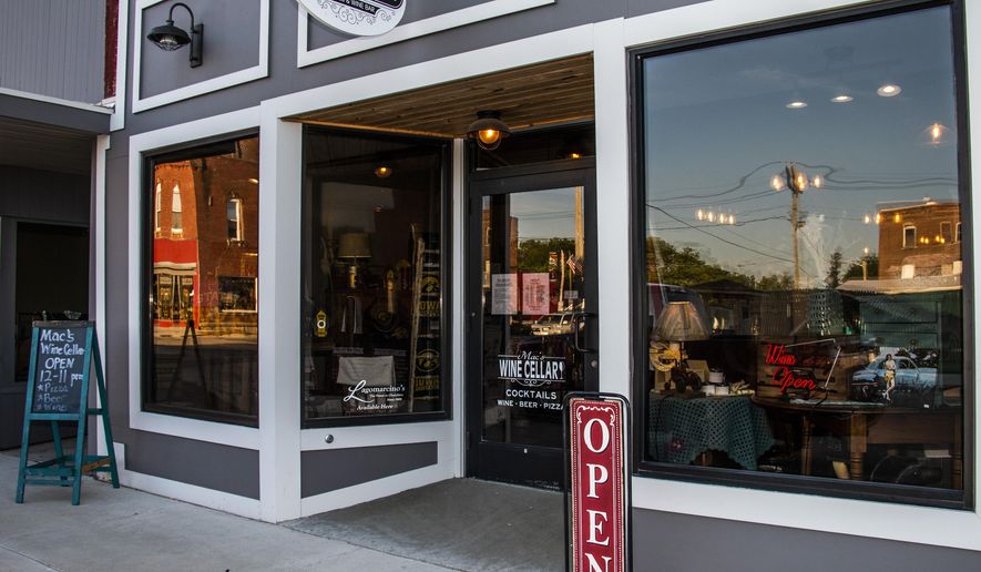 A May 25, 2019 photo shows the exterior of Farmers Creek Antiques & Mac's Wine Cellar in Maquoketa, Iowa. (Katina Zentz/Telegraph Herald via AP)