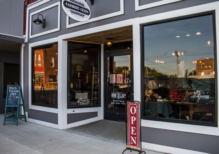 A May 25, 2019 photo shows the exterior of Farmers Creek Antiques & Mac's Wine Cellar in Maquoketa, Iowa. (Katina Zentz/Telegraph Herald via AP)
