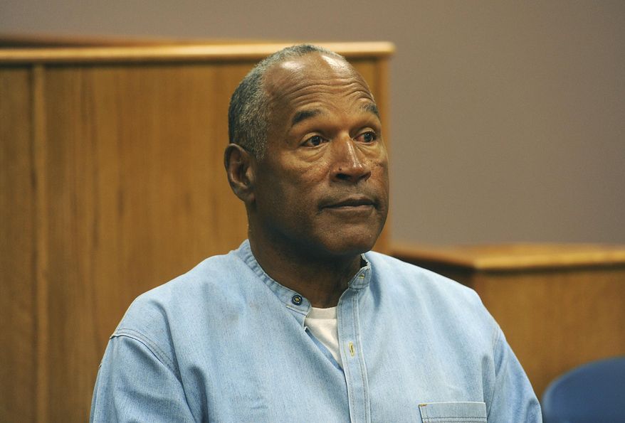 In this July 20, 2017, file photo, former NFL football star O.J. Simpson appears via video for his parole hearing at the Lovelock Correctional Center in Lovelock, Nev.  Simpson has launched a Twitter account with a video post in which the former football star says he’s got a “little gettin’ even to do.” Simpson confirmed the new account to The Associated Press on Saturday, June 15, 2019. Simpson said in a phone interview it will be a lot of fun and that he had some things to straighten out. (Jason Bean/The Reno Gazette-Journal via AP, Pool, File) ** FILE **