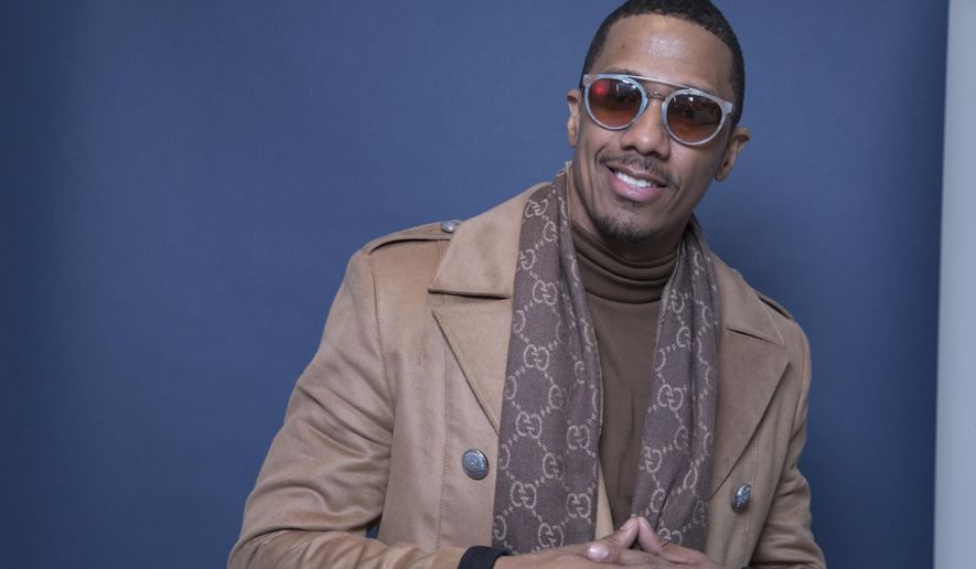 FILE - In this Dec. 10, 2018 file photo Nick Cannon poses for a portrait in New York.  Cannon is on the radio.  Meruelo Media on Friday, June 14 ,2019  announced the rapper, comedian and actor is joining Los Angeles hip-hop radio station Power 106 as host of its morning show. “Nick Cannon Mornings” launches Monday from 5 to 10 a.m.  In a statement, Cannon says he’s honored for the opportunity to “make our community and culture proud.”  (Photo by Amy Sussman/Invision/AP)