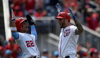 The Washington Nationals&#39; Matt Adams (right) celebrates his three-run home run with Juan Soto in the third inning of a 15-5 win over the Arizona Diamondbacks on Sunday. Adams had a career-high seven RBI after he added a grand slam in the eighth inning. (ASSOCIATED PRESS)