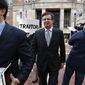In this March 8, 2018, file photo, Jason Maloni, left, former Trump campaign chairman Paul Manafort&#39;s spokesman, left, walks with Paul Manafort, center, as they leave the Alexandria Federal Courthouse after an arraignment hearing in Alexandria, Va. (AP Photo/Jacquelyn Martin) ** FILE **
