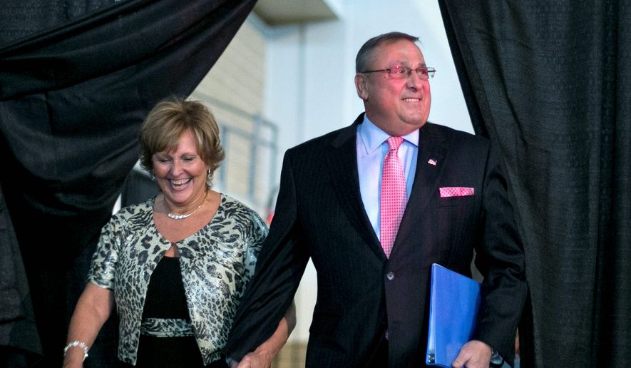 This April 26, 2014, file photo shows then-Maine Gov. Paul LePage and first lady Ann LePage arriving at the Maine Republican Convention, in Bangor, Maine. (AP Photo/Robert F. Bukaty, File)