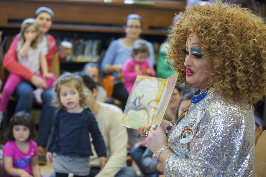 A drag queen reads to children during the Feminist Press&#39; presentation of Drag Queen Story Hour at the Park Slope Branch of the Brooklyn Public Library, in New York, May 13, 2017. (AP Photo/Mary Altaffer) ** FILE **