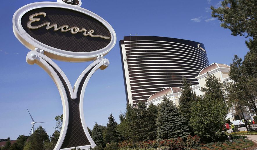 FILE - This May 22, 2019 file photo shows Encore Boston Harbor in Everett, Mass. The $2.6 billion Wynn resort casino is scheduled to open June 23 transforming a contaminated property into what is billed as a waterfront oasis. (AP Photo/Michael Dwyer, File)