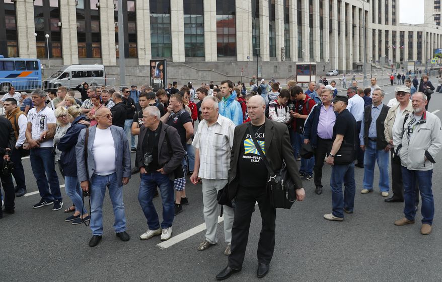 Demonstrators gather to attend a rally titled "Law and justice for all" in support of all journalists in Moscow, Russia, Sunday, June 16, 2019. (AP Photo/Pavel Golovkin)