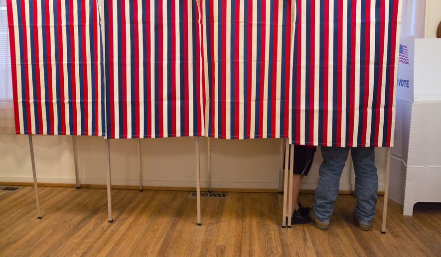 In this Nov. 8, 2016, photo, a voter fills out his ballot at the Wilson School House in unincorporated Wilson, Idaho. Donald Trump’s victory came as a surprise to many Americans, the nation’s pollsters most of all. Heading into Election Day, most national surveys overstated what will likely be a narrow popular vote advantage for Hillary Clinton and led many to believe she was a shoo-in to win the Electoral College. (AP Photo/Otto Kitsinger)