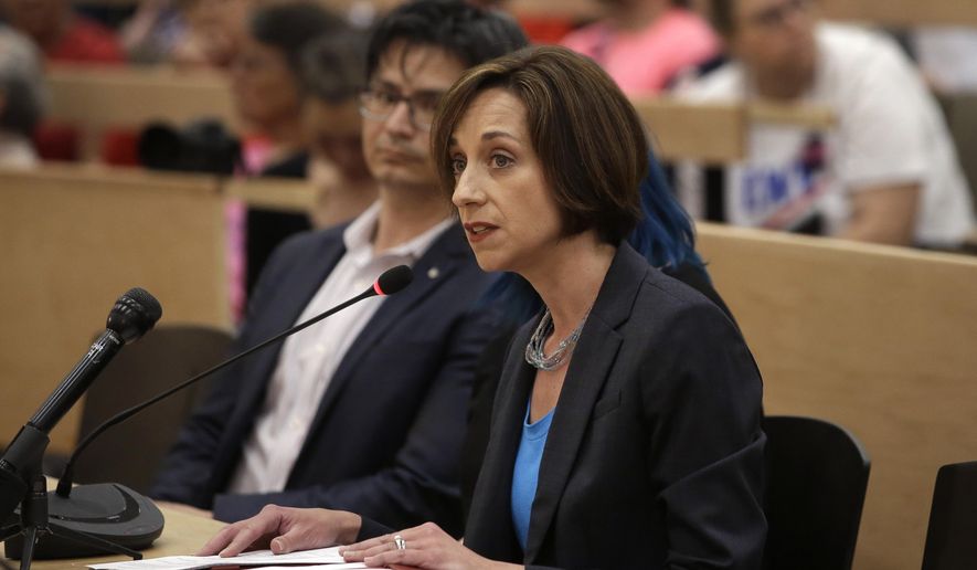 Myrna Maloney Flynn, vice president, Massachusetts Citizens for Life, right, testifies against a proposed bill, called the "Roe Act" by supporters, during a public hearing as David Franks, chairman of Mass. Citizens for Life, left, looks on during a public hearing at the Statehouse, Monday, June 17, 2019, in Boston. Proponents on both sides of the abortion issue testified during the public hearing on a bill that would let women obtain an abortion after 24 weeks of pregnancy in cases of "fatal fetal anomalies." (AP Photo/Steven Senne)